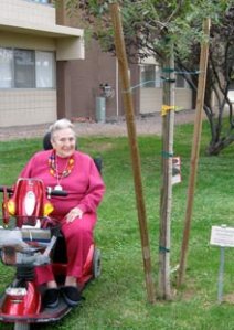 Sherrill Moore visits a tree she donated about six months ago at Kivel Campus of Care's assisted-living facility.